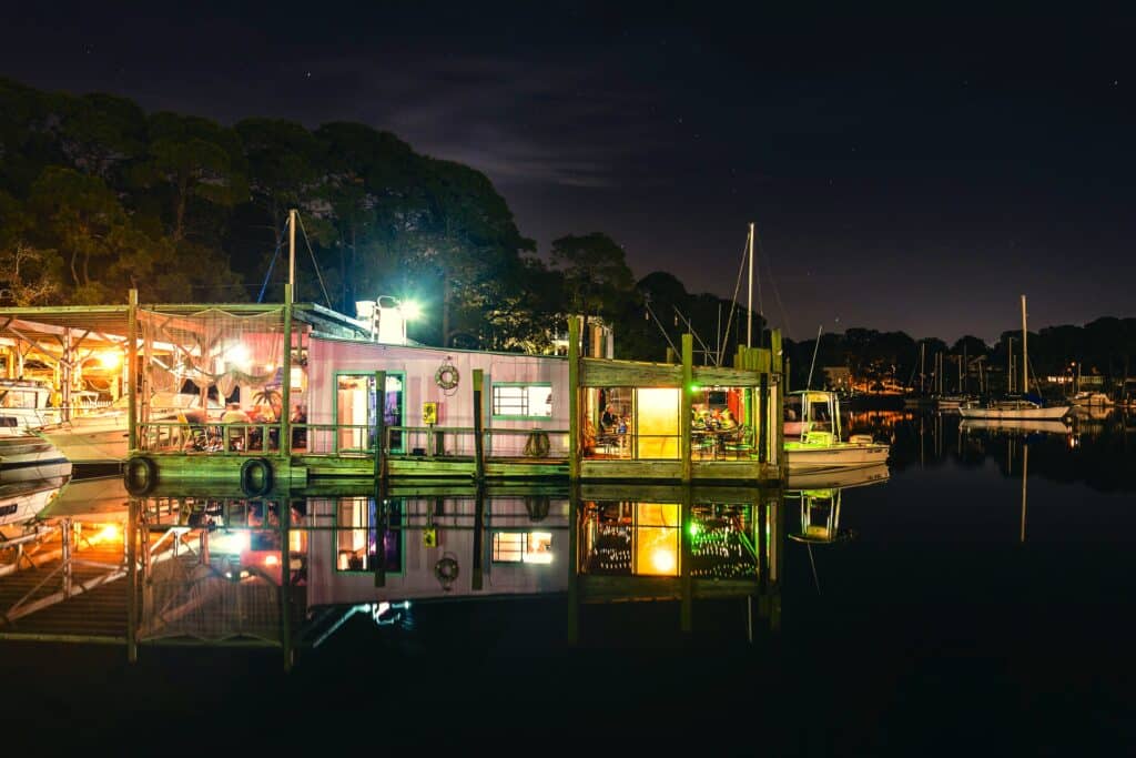 Photo of Bayou Joe's On Massalina Bayou at night on the water | waterfront restaurant in Panama City, Florida offering breakfast, lunch & dinner with a view